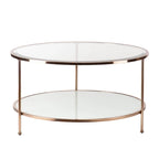 Table basse ronde or et cuivre avec rangement et plateau en verre, pieds tripodes
