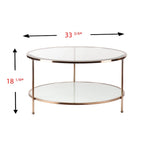 Table basse ronde or et cuivre avec rangement et plateau en verre, pieds tripodes