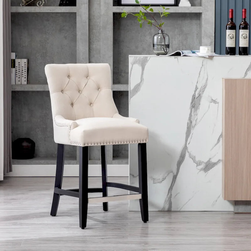 Tabouret de comptoir Carter 24 capitonné, pieds noirs